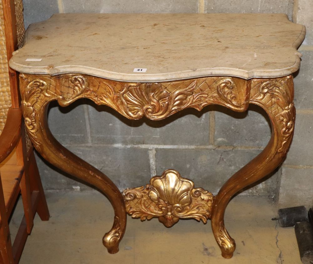 An 18th style French giltwood and gesso marble top serpentine console table, W.84cm, D.50cm, H.78cm